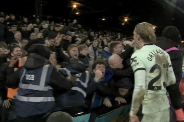 Chelsea fans crash through advertising hoardings celebrating late Crystal Palace winner