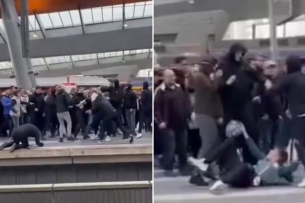 Moment Ajax hooligans ‘attack Aston Villa fans at train station’ as punches and kicks fly