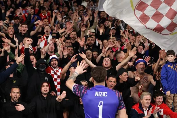 Football fan accused of Nazi salute at match claims his beer proves he’s innocent
