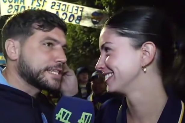 Football reporter smooches stunning fan as sparks fly during interview
